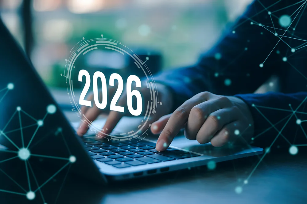 Notebook exibindo um site profissional de alta performance com gráficos de custos em 2026.